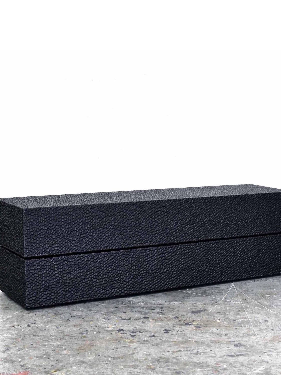 Reveal Bench #1 in carved, blackened maple by John Eric Byers for RUNE, New York.