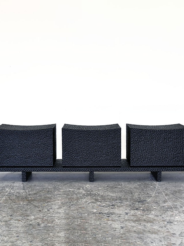 Front view of Loft Bench Revised in carved blackened maple by John Eric Byers for RUNE, New York.
