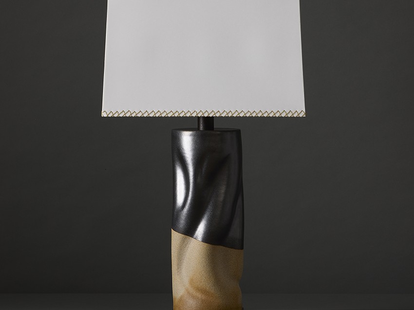 High contrast, sculptural artisan stoneware table lamp in white clay & matte black glaze by ceramic artist Clate Grunden, available from RUNE, New York, offers a striking aesthetic for modern interiors.