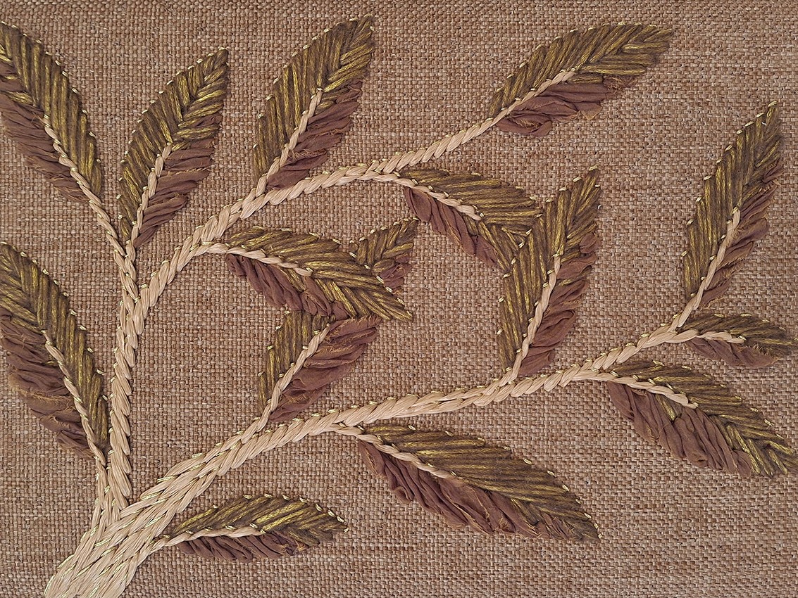 P+L Studio's handmade embroidery using traditional techniques to create a modern branch & leaf design that appears to grow organically across a beautifully textured fabric, available at RUNE, New York.