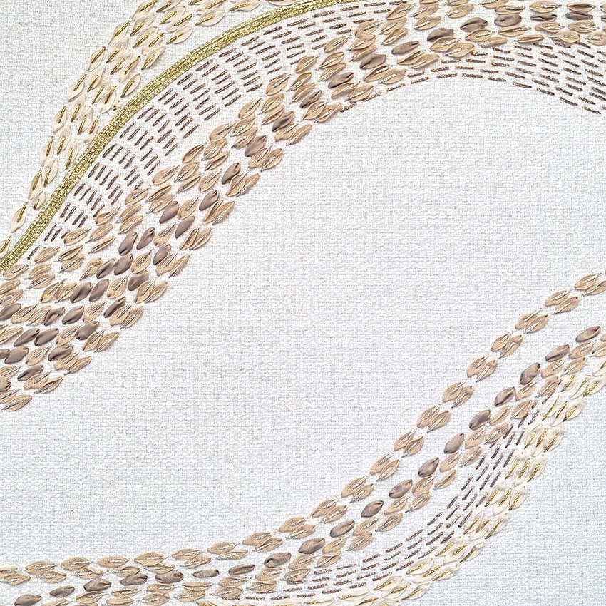 Detailed view of P+L Studio’s French embroidered fabric, highlighting colorful threadwork & texture in a modern, wave-like pattern.